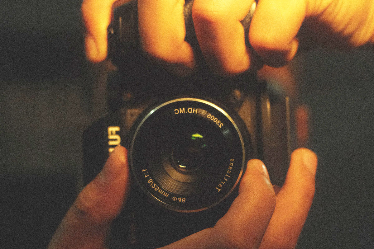 Hands holding a camera